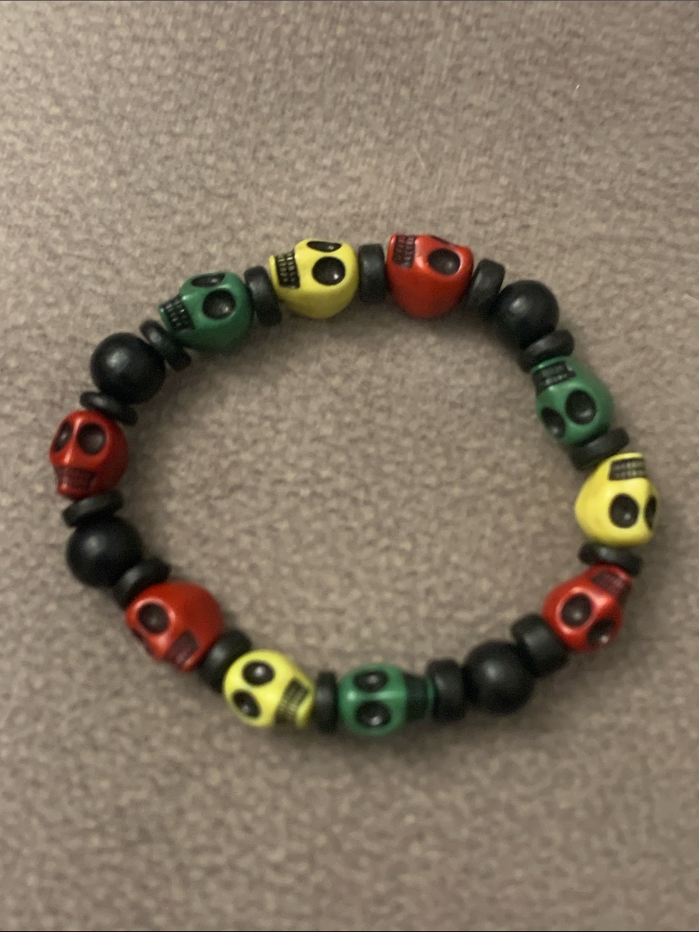 Stretch Bracelet with Red, Yellow & Green Skull Beads